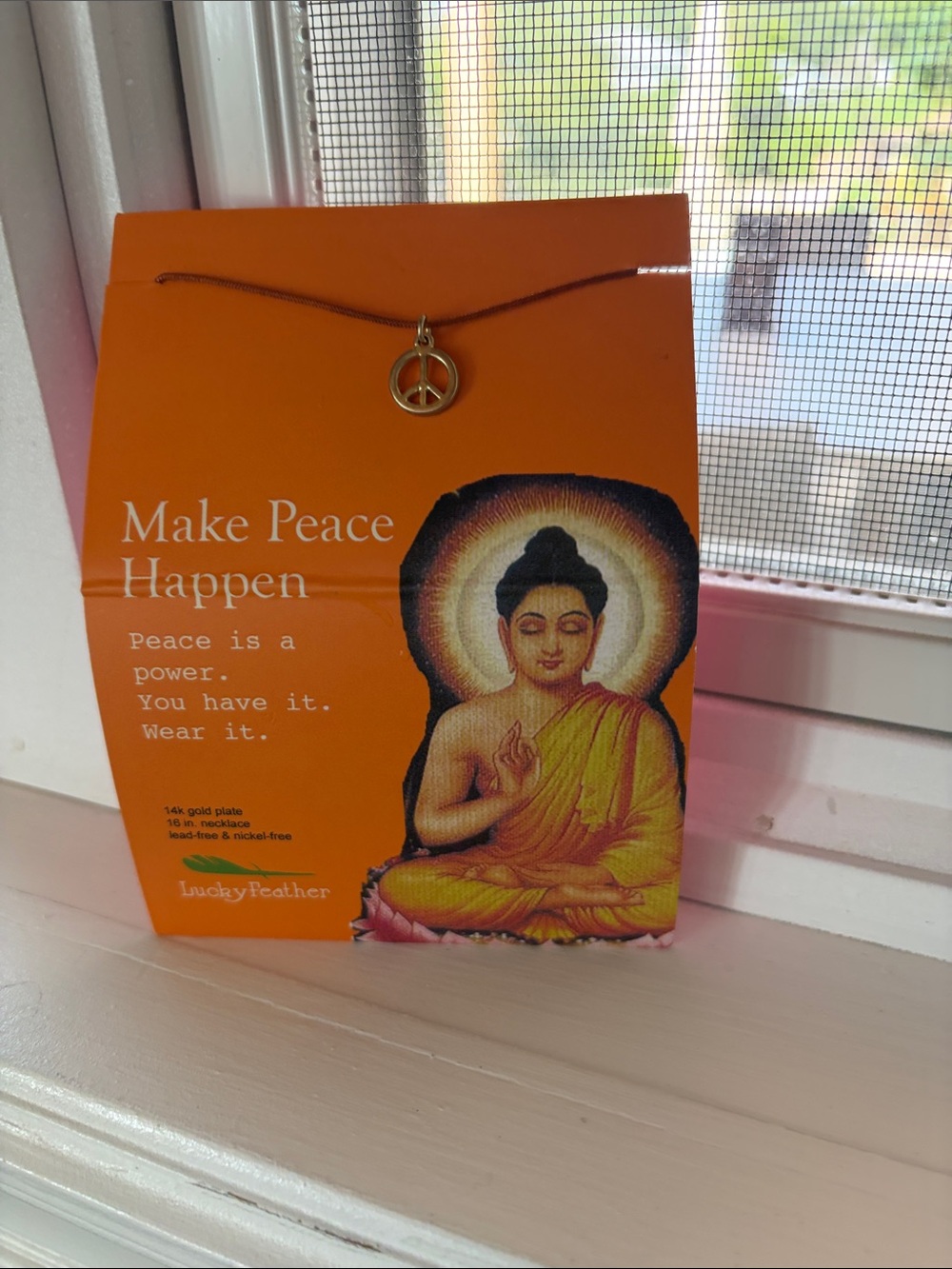 Gold Peace Pendant Necklace on Orange Cord